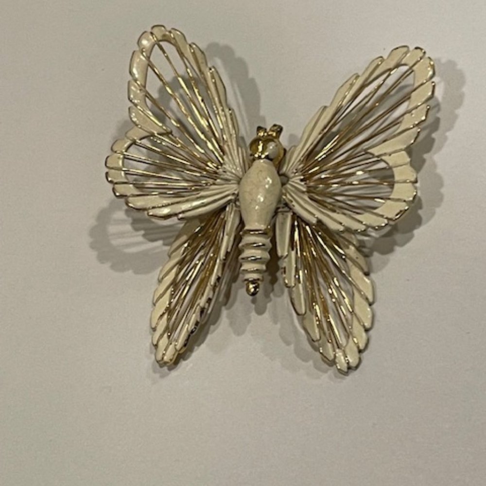 Vintage Monet white enamel and gold tone butterfly pin
